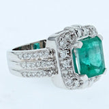 3.25ct emerald cut emerald and diamond ring