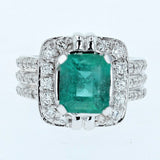 3.25ct emerald cut emerald and diamond ring